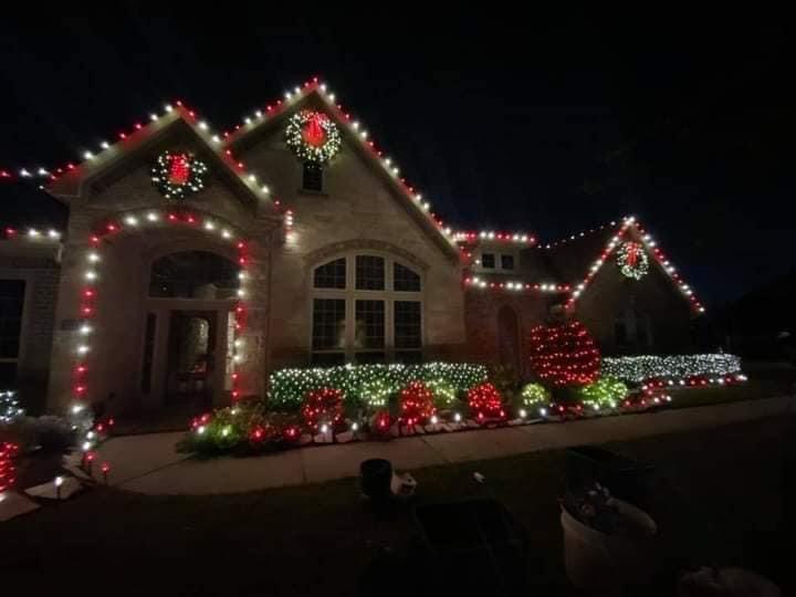 A house covered in christmas lights and decorations