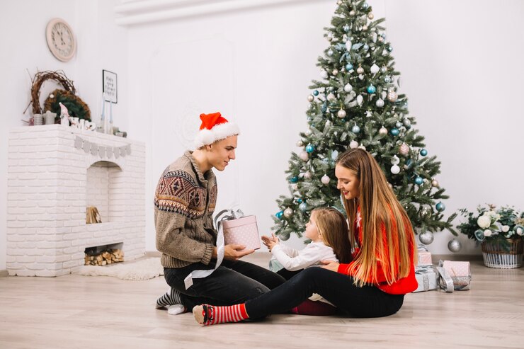 young couple celebrating christmas home